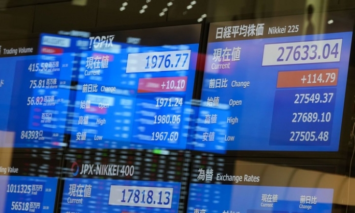 Asian markets mixed as traders weigh rates outlook